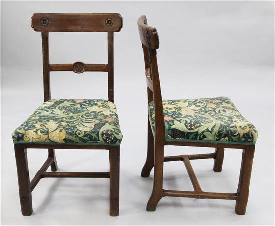 A set of four Victorian gothic dining chairs,